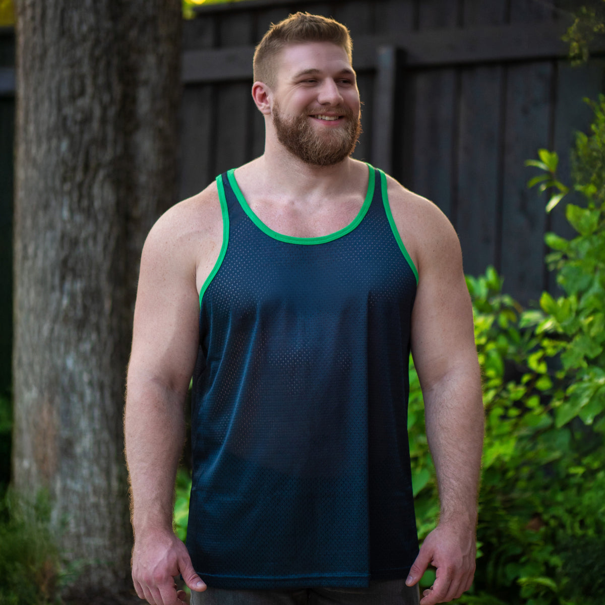 Handsome bearded cub in a navy see through GruffPup tank top