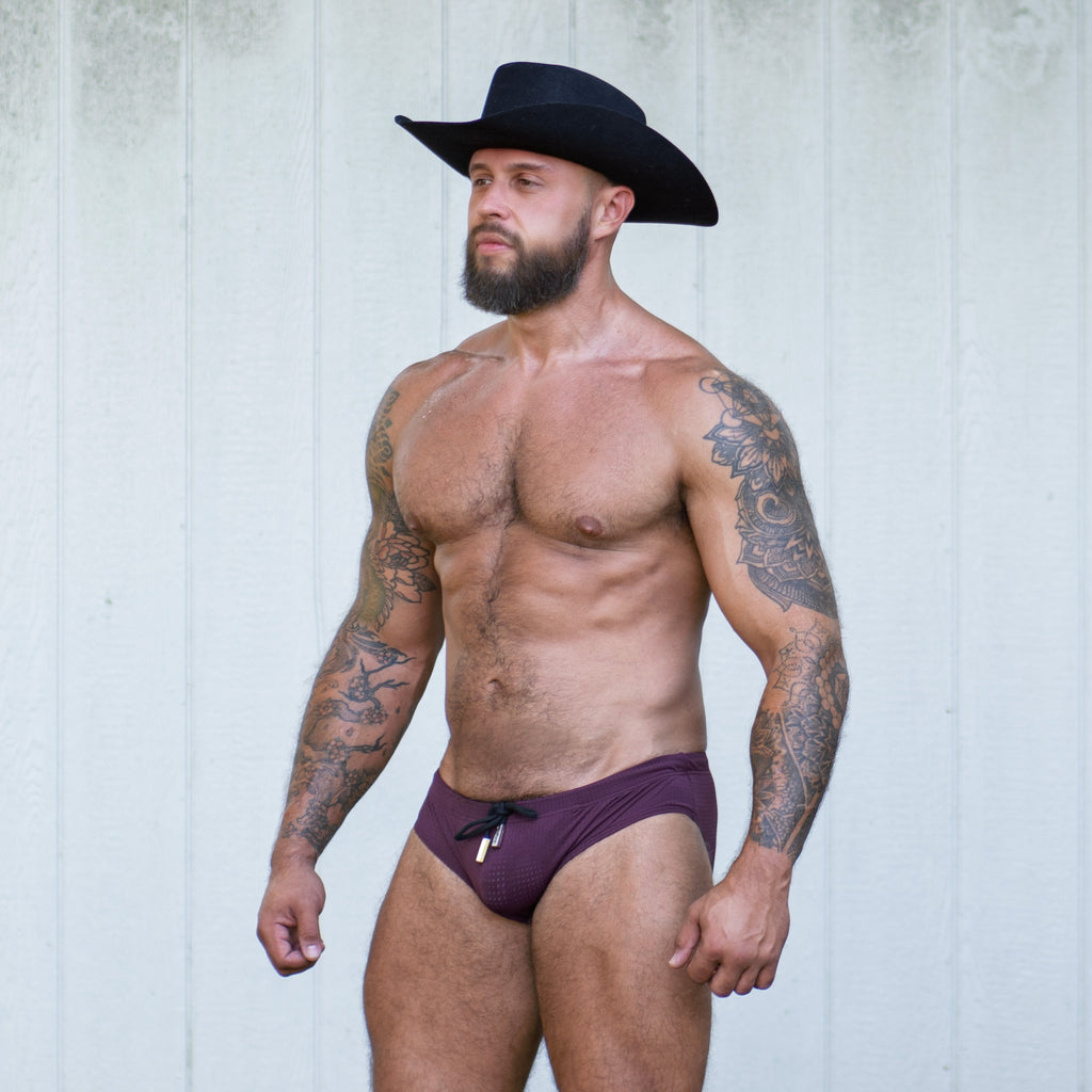 Stuart in the Gruff Pup Bulge Boost Swim Brief (Burgundy)