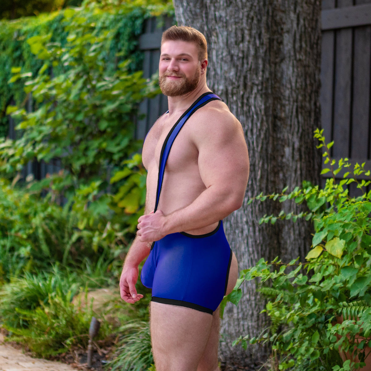 Riley in the Gruff Pup Impulse Singlet (Blue/Black Bare Back)