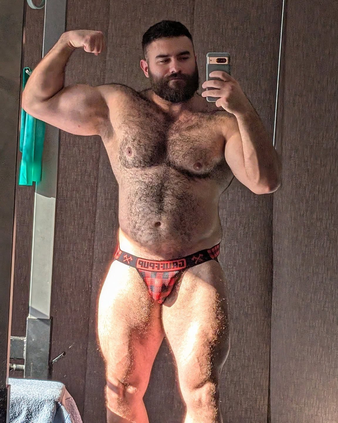 Customer taking a mirror selfie in a Gruff Pup Lumberjack Jockstrap